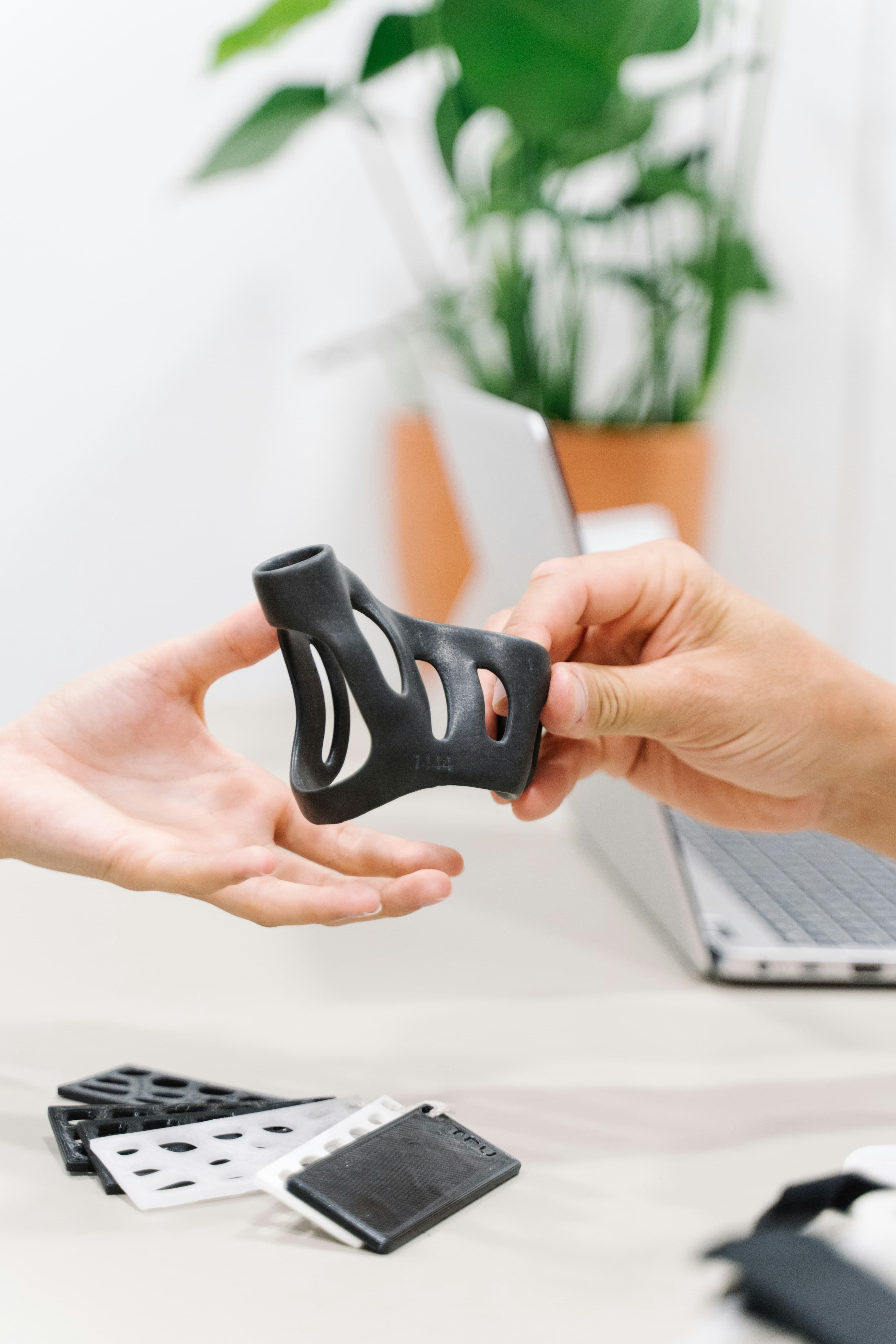 3D printed products and materials organized in AK Innovations workshop